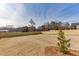 A view of the expansive, level backyard, enclosed by a wooden fence for privacy at 2870 S Waterworks Rd, Buford, GA 30518