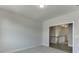 Bright hallway featuring neutral decor and carpeted floors leading to the staircase, offering a welcoming transition at 2870 S Waterworks Rd, Buford, GA 30518