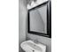 Cozy half bathroom with a stylish mirror, sink, and modern lighting at 3154 Panthers Trce, Decatur, GA 30034