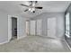 Bedroom featuring carpeted floors, a ceiling fan, closet doors and an attached nook at 3154 Panthers Trce, Decatur, GA 30034