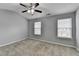 Bright bedroom with neutral walls, carpeted flooring, and a modern ceiling fan at 3154 Panthers Trce, Decatur, GA 30034