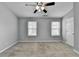 Spacious bedroom featuring plush carpeting, neutral walls, and a ceiling fan at 3154 Panthers Trce, Decatur, GA 30034