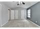 Bedroom featuring carpeted floors, ceiling fan, closet, and a window that brings in natural light at 3154 Panthers Trce, Decatur, GA 30034
