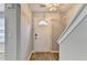 Bright foyer featuring a white door, hardwood floors, and contemporary lighting, creating a welcoming entry at 3154 Panthers Trce, Decatur, GA 30034