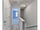 Hallway with gray walls, carpeted floor, and access to other rooms at 3154 Panthers Trce, Decatur, GA 30034
