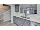 This kitchen features gray cabinets, quartz countertops, and stainless steel appliances at 3154 Panthers Trce, Decatur, GA 30034