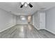 Bright living room showcasing modern flooring, a ceiling fan, and an open doorway at 3154 Panthers Trce, Decatur, GA 30034