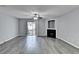 Spacious living room with luxury vinyl plank flooring, fan, fireplace, and sliding glass doors to outdoor space at 3154 Panthers Trce, Decatur, GA 30034