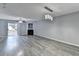 Spacious living room with luxury vinyl plank flooring, fan, fireplace, and sliding glass doors to outdoor space at 3154 Panthers Trce, Decatur, GA 30034
