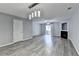 Spacious living room with luxury vinyl plank flooring, fan, fireplace, and sliding glass doors to outdoor space at 3154 Panthers Trce, Decatur, GA 30034