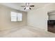 Spacious bedroom with ceiling fan and large window, offering plenty of natural light at 563 Carleton Pl, Locust Grove, GA 30248
