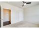 Cozy bedroom with carpet, ceiling fan, and a doorway leading to another room at 563 Carleton Pl, Locust Grove, GA 30248