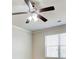 Bedroom featuring a ceiling fan above a window with horizontal blinds in a neutrally decorated room at 563 Carleton Pl, Locust Grove, GA 30248