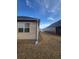 Side view of home exterior showing the lawn and gutter system at 563 Carleton Pl, Locust Grove, GA 30248