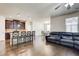 Open-concept living area with an island, kitchen, and a large sectional couch at 563 Carleton Pl, Locust Grove, GA 30248