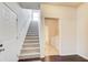 Stairway with carpeted steps adjacent to a laundry room at 563 Carleton Pl, Locust Grove, GA 30248