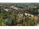 A beautiful aerial view of a neighborhood showcasing the community tennis court, clubhouse, and lush landscaping at 313 Revolution Dr, Peachtree City, GA 30269