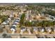 An aerial view of a residential neighborhood showcasing well-manicured lawns and tree-lined streets at 313 Revolution Dr, Peachtree City, GA 30269