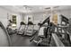 Well-equipped gym features treadmills, weight machines, and natural light filtering through shuttered windows at 313 Revolution Dr, Peachtree City, GA 30269