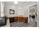 A modern kitchen area includes stainless steel appliances and wood cabinets at 313 Revolution Dr, Peachtree City, GA 30269