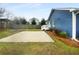 Backyard showcasing an ample concrete parking area, fenced yard and building exterior at 318 Kelly Se St, Atlanta, GA 30312