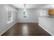 Bright dining room with hardwood floors, large windows, and modern light fixture at 318 Kelly Se St, Atlanta, GA 30312