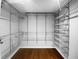 Walk-in closet featuring wood floor and metal shelving at 318 Kelly Se St, Atlanta, GA 30312