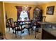 Formal dining room with elegant decor, chandelier lighting, and a classic dining set at 355 Tait Rd, Stockbridge, GA 30281