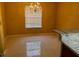 Bright dining room features a chandelier, large window, and tile flooring at 355 Tait Rd, Stockbridge, GA 30281