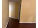Hallway with dark hardwood floors connecting various areas of the home at 355 Tait Rd, Stockbridge, GA 30281