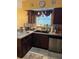 This modern kitchen features granite countertops, tile backsplash and an undermount sink at 355 Tait Rd, Stockbridge, GA 30281