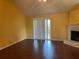 Spacious living room with wood floors, a fireplace, and sliding glass doors at 355 Tait Rd, Stockbridge, GA 30281