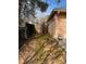 Wood fencing enclosing the side yard with a small area for gardening at 355 Tait Rd, Stockbridge, GA 30281