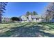 Full view of the back of the home and yard showcasing the deck at 3736 Rainbow Cir, Snellville, GA 30039