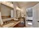 This bathroom offers a double sink vanity with granite countertops at 3736 Rainbow Cir, Snellville, GA 30039