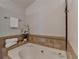 The main bathroom includes a soaking tub with tile surround at 3736 Rainbow Cir, Snellville, GA 30039