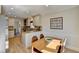 Bright dining area with natural light, open to the kitchen with modern finishes at 3736 Rainbow Cir, Snellville, GA 30039