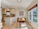 Open concept kitchen and dining area, featuring modern finishes and natural light at 3736 Rainbow Cir, Snellville, GA 30039