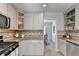 A modern kitchen featuring granite countertops, stainless steel appliances, and ample cabinet space at 3736 Rainbow Cir, Snellville, GA 30039