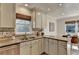 Well-lit kitchen with stainless steel appliances, granite countertops, and a stylish backsplash at 3736 Rainbow Cir, Snellville, GA 30039