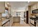 Bright kitchen showcasing stainless steel appliances, granite countertops, and ample cabinet space at 3736 Rainbow Cir, Snellville, GA 30039