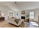 Bright living room boasts vaulted ceiling, fireplace, and an open floor plan at 3736 Rainbow Cir, Snellville, GA 30039