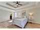 The main bedroom features a ceiling fan and is adjacent to the main bathroom at 3736 Rainbow Cir, Snellville, GA 30039