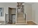 Staircase features wood steps, white railings, and neutral paint at 3736 Rainbow Cir, Snellville, GA 30039