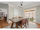 Dining room with modern light fixture and access to patio at 108 Great Oaks Lane, Roswell, GA 30075