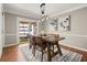 Dining room with modern light fixture and access to patio at 108 Great Oaks Lane, Roswell, GA 30075