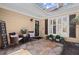 Cozy front porch with seating, décor, and stone paving leading to the front door at 108 Great Oaks Lane, Roswell, GA 30075