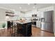 Modern kitchen with stainless steel appliances, granite countertops, and central island seating at 108 Great Oaks Lane, Roswell, GA 30075