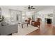 Bright living room with plantation shutters connects to the kitchen at 108 Great Oaks Lane, Roswell, GA 30075