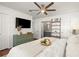 Bright bedroom with a ceiling fan, TV and attached bathroom at 108 Great Oaks Lane, Roswell, GA 30075